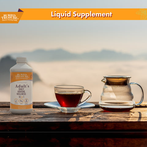 Image with bottle of Buried Treasure Adult Daily Immune Wellness with a cup of tea and pot of hot water, depicting immune wellness.