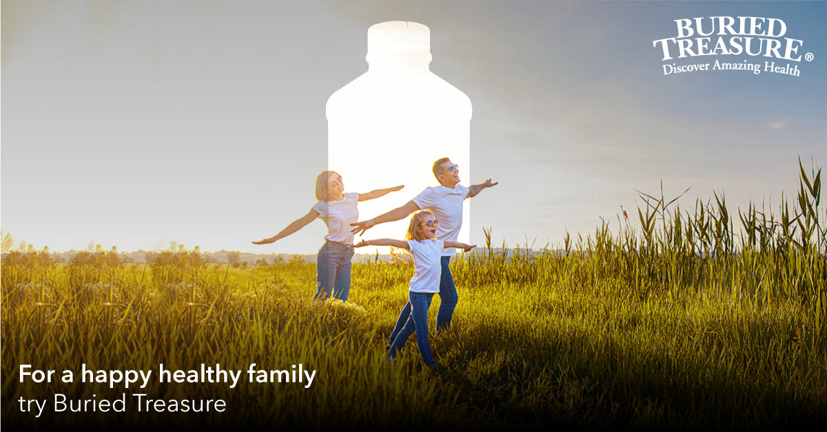 Family Field Scene – 30-Year Buried Treasure Legacy Three generations of family in sunny field symbolizing Buried Treasure’s 30-year liquid supplement legacy